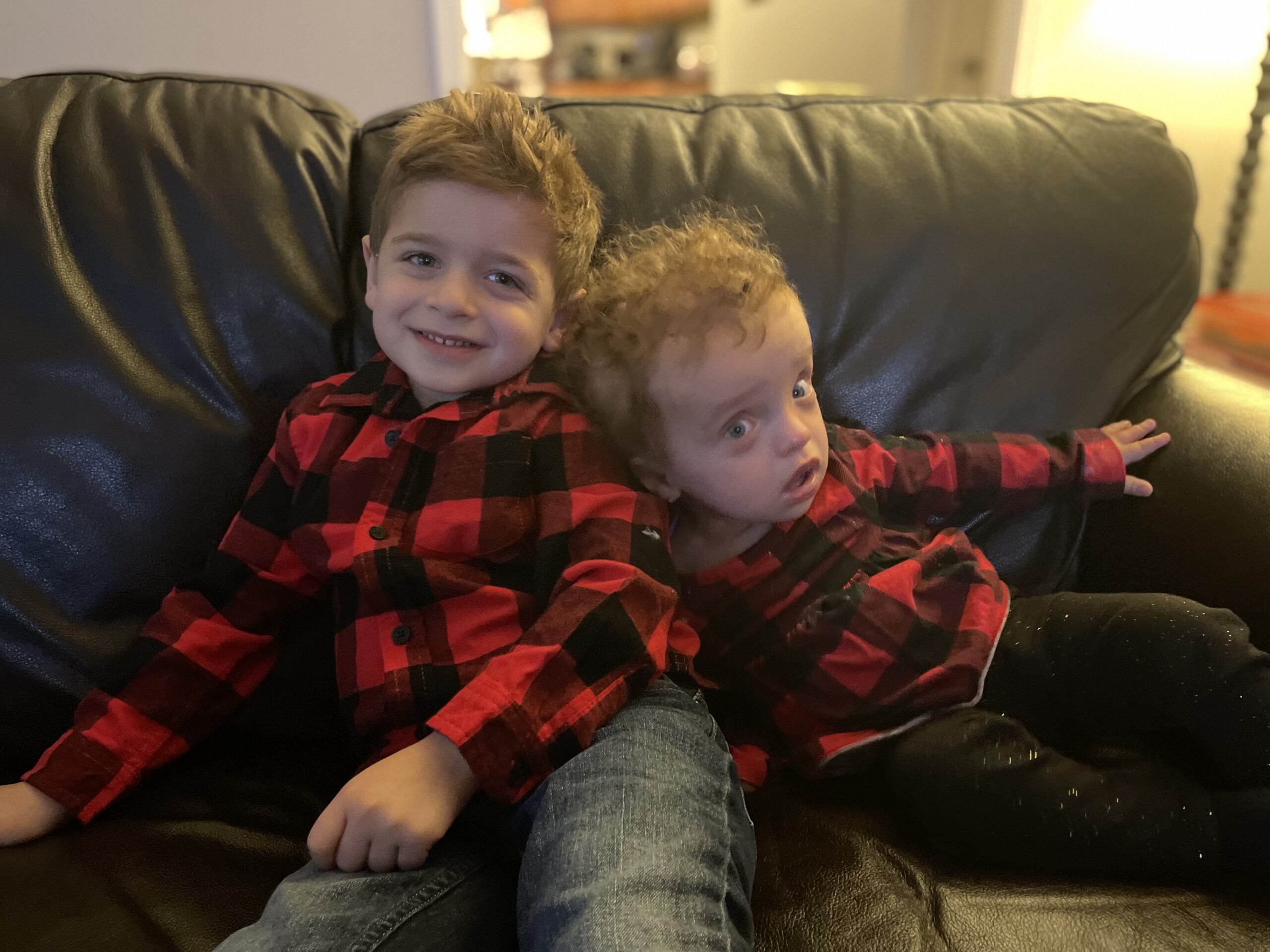 Noah and Hailey in matching flannel red and black long sleeve shirts